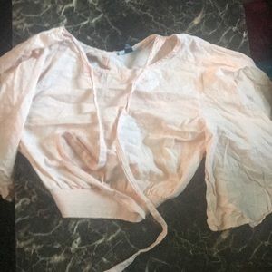 a pink ruffled shirt